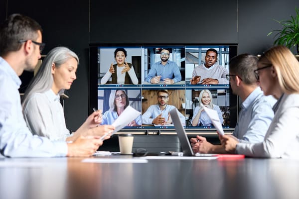 Hybrid team meeting partially in conference, video call
