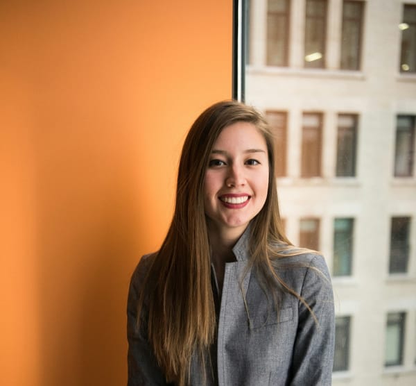 Portrait of a young employee with longhair
