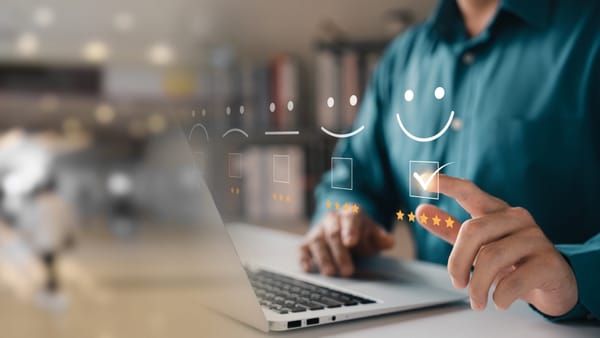 A stylized image of a person filling out an employee engagement satisfaction survey