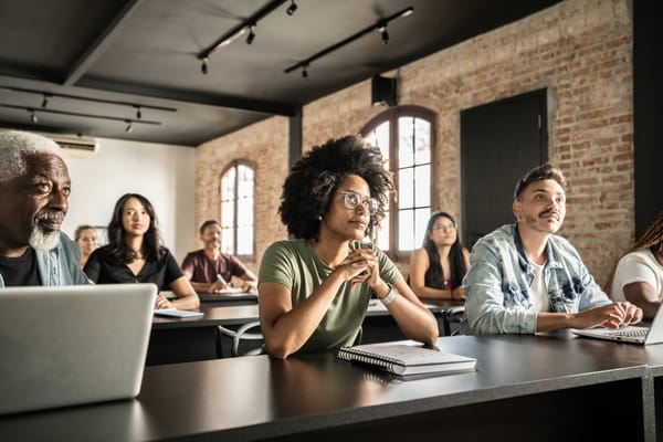 A diverse group of employees engage in professional development