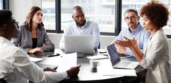 A team discusses psychosocial risk in an organization